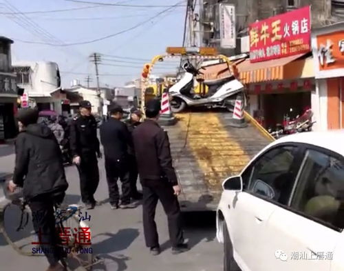 溪头镇春节期间交通严管 车站至镇政府路段违章停车一律拖车